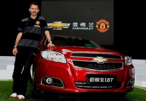 Manchester United player Ryan Giggs with the Chevrolet Malibu